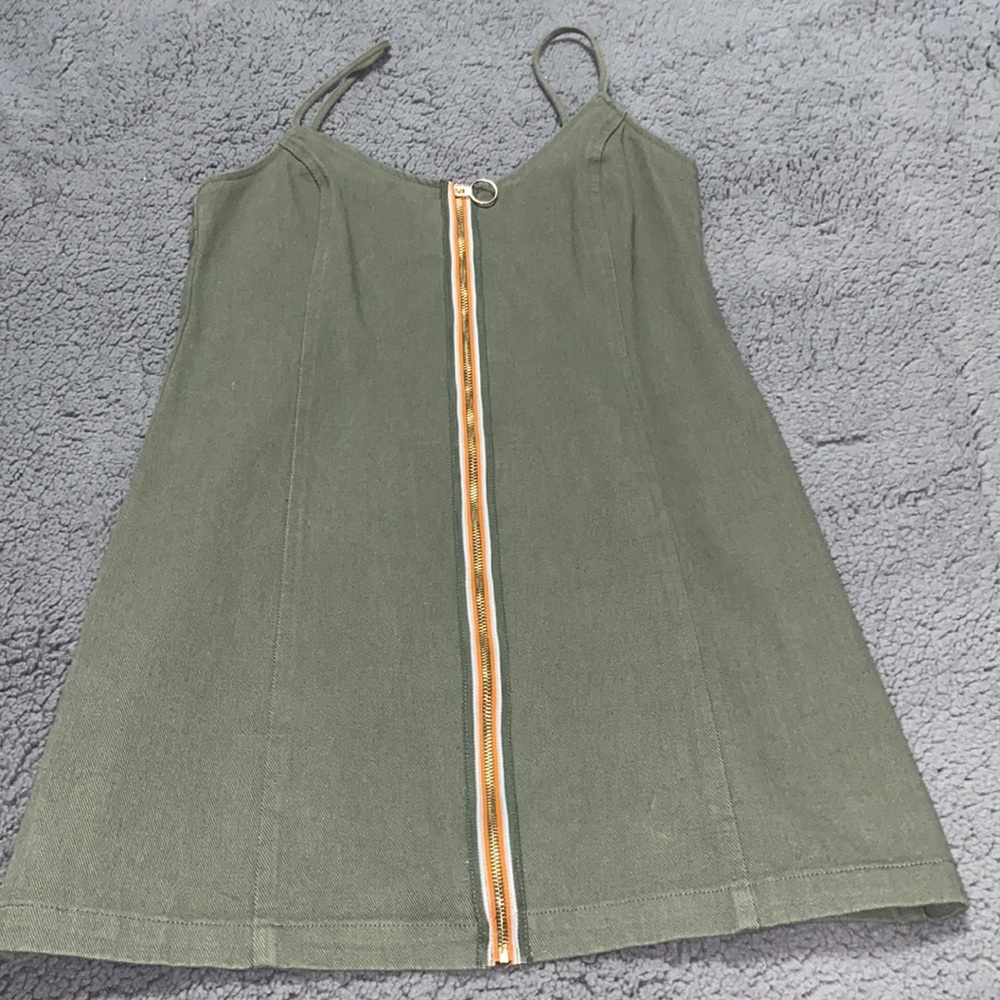 Mini army green dress with gold zipper on the front and spaghetti straps